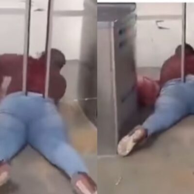 mujer atascada por colarse en Transmilenio