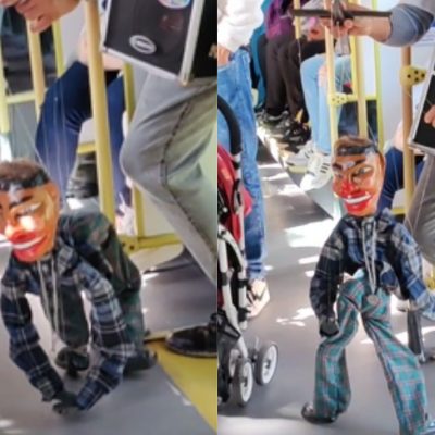 video de marioneta bailando reguetón en Transmilenio